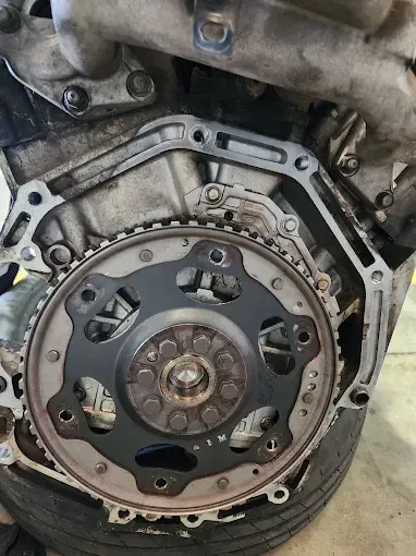 Engine flexplate exposed with the transmission removed