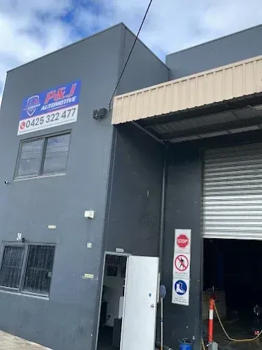 P&J Automotive building on Harvester Ave showing the business sign and phone number 0425 322 477