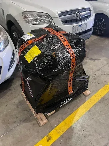 Replacement engine delivered wrapped on a pallet in the workshop