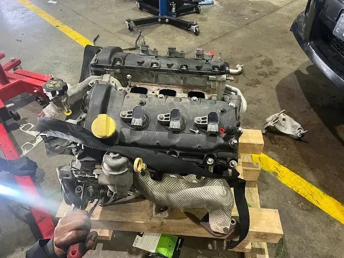 Replacement engine on a pallet ready to be fitted at P&J Automotive
