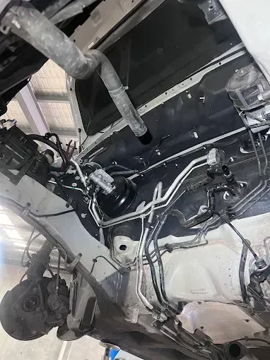 Underbody of a vehicle on the hoist during an inspection